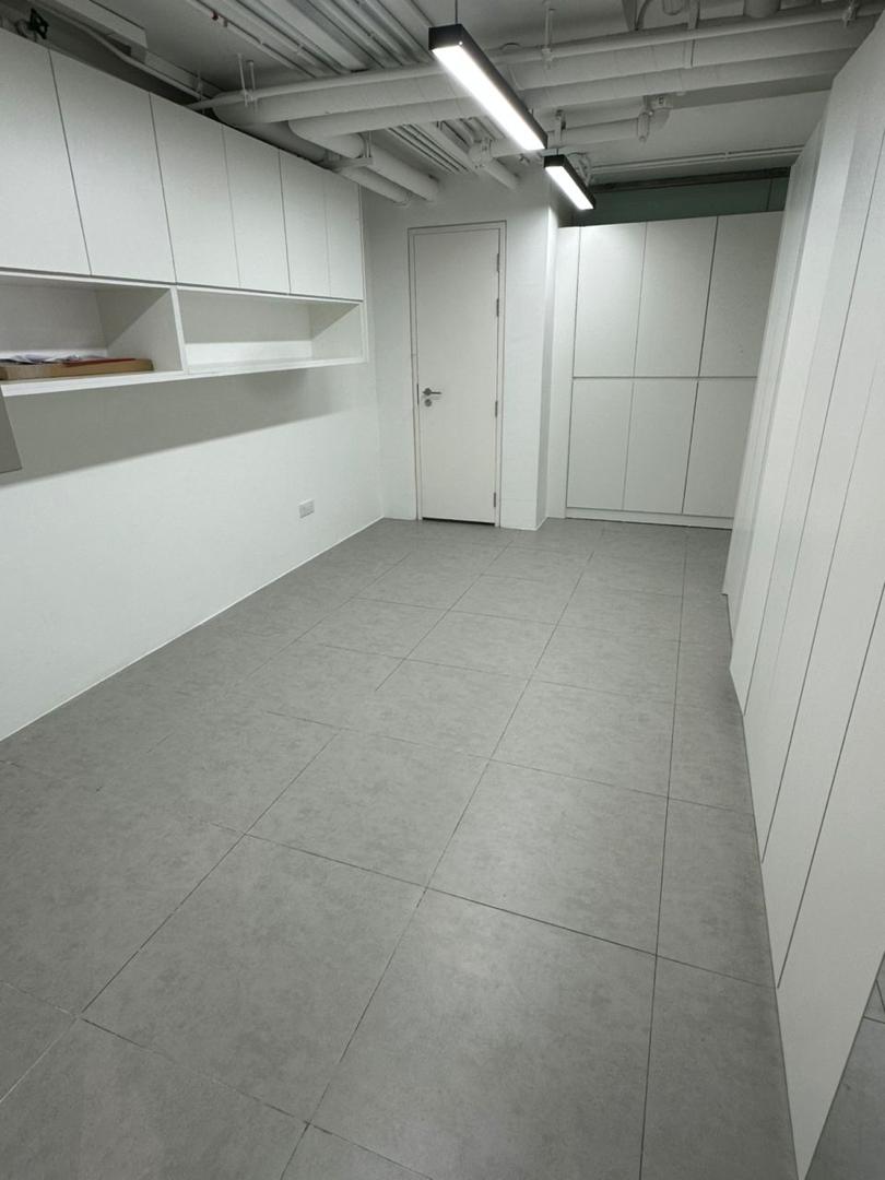 Commercial office renovation with custom full-height storage cabinets by Fata Bestari