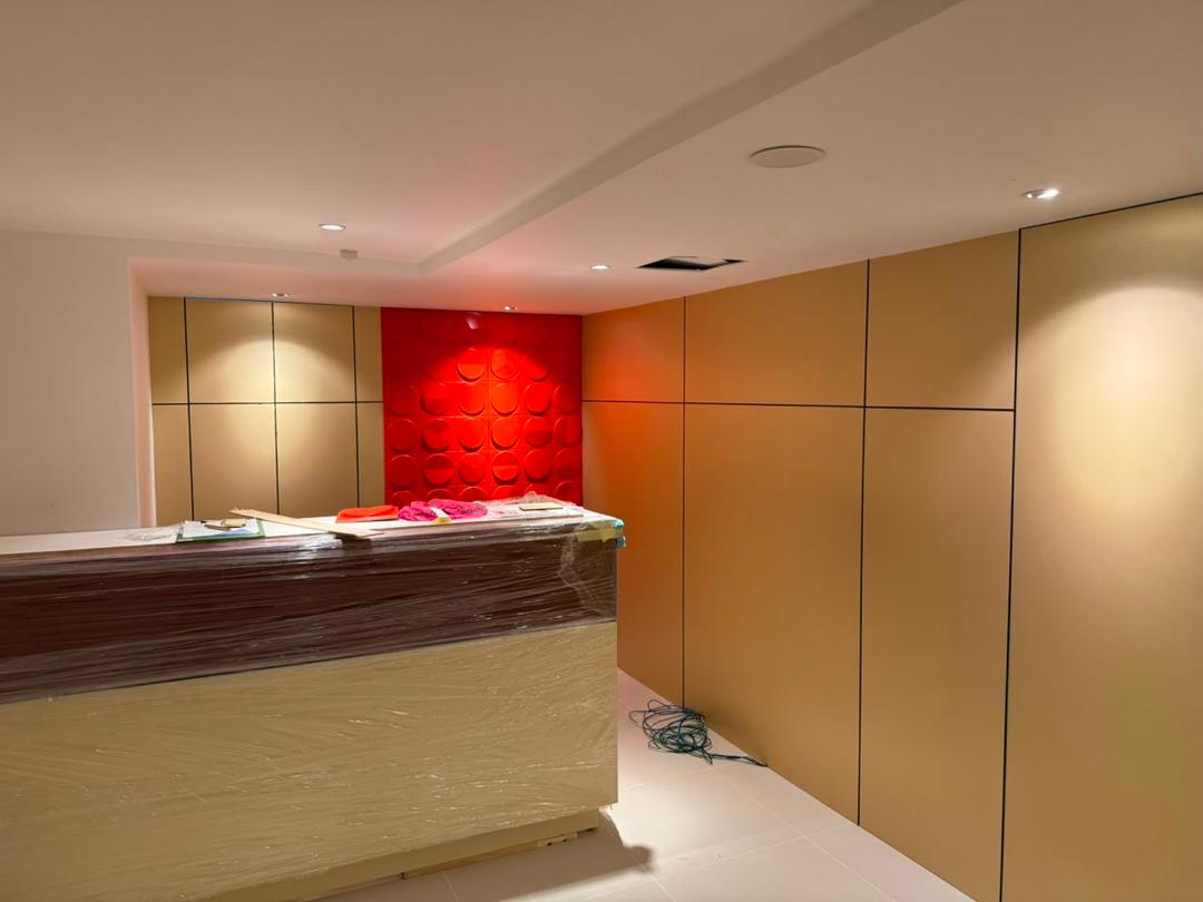 Commercial office reception counter with custom feature wall panels
