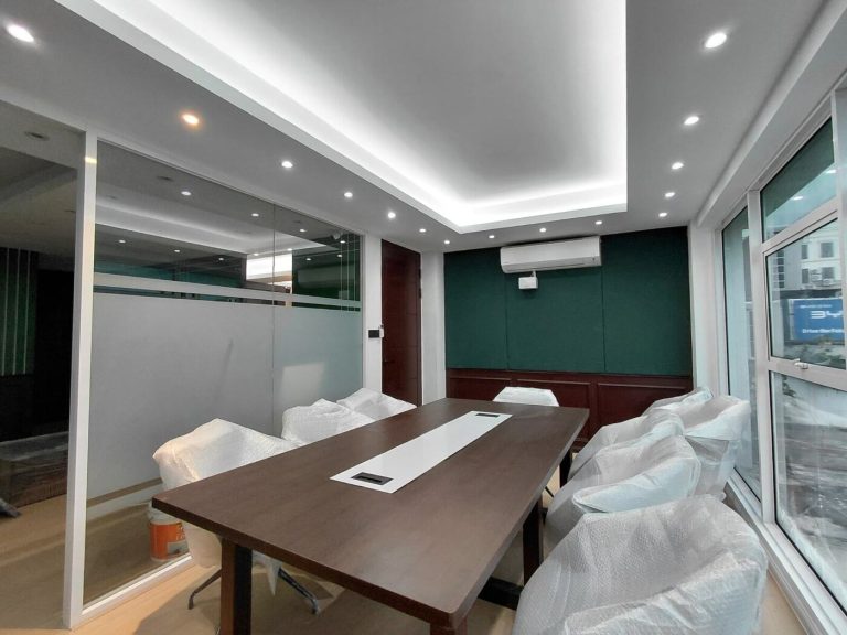 Ralph Lauren concept office boardroom with glass partition, recessed lighting and custom meeting table