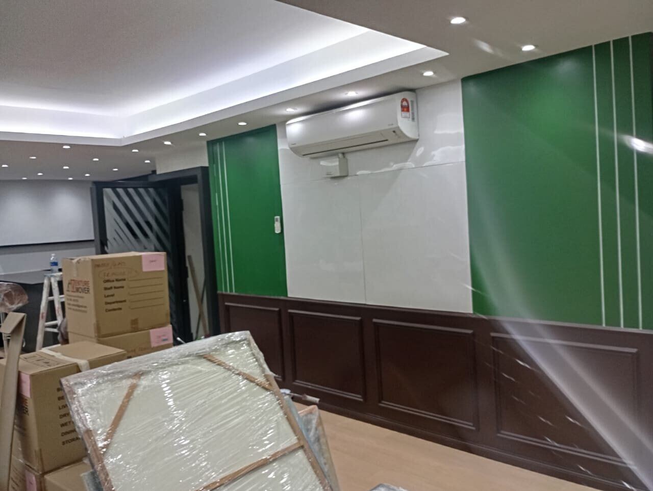 Ralph Lauren inspired corporate office feature wall with green panels and dark timber wainscoting